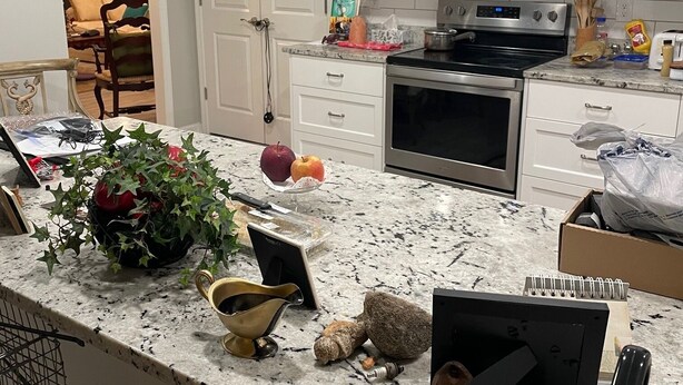 A kitchen with white cabinets, a stainless steel microwave, and an oven. There is a plant on the counter and a box of cereal. - Great Masters rental, walking distance to the tournament. (Augusta)