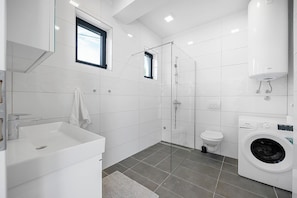 Shower, hair dryer, towels, soap
