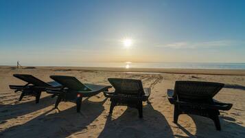 On the beach, sun loungers