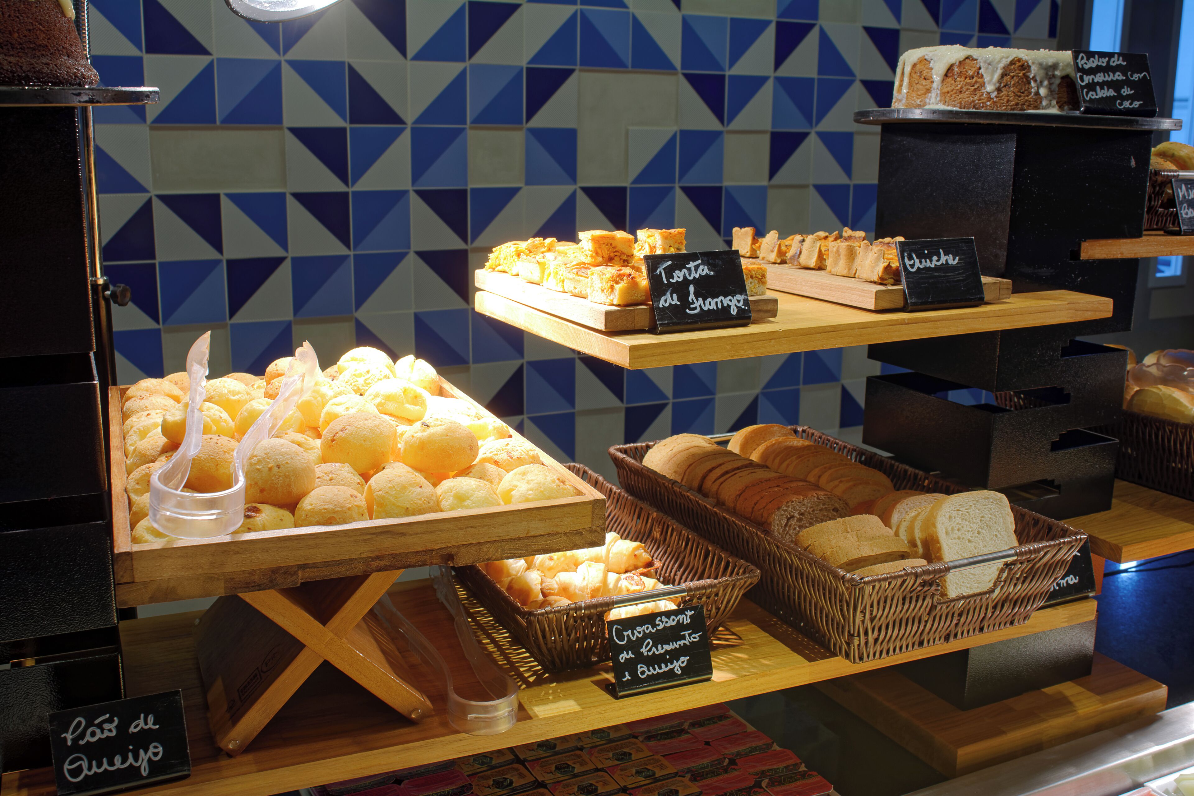 A bakery display with various baked goods.
