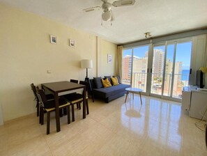 Enjoy the city and sea views from the balcony through the large sliding glass door.