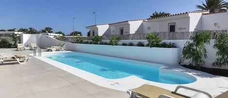 Sky, Property, Plant, Water, Swimming Pool, Building, Outdoor Furniture, Shade, Tree, Sunlounger