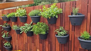 Tiered planters create a lush, verdant oasis.