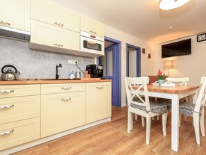 Microwave, toaster, dining tables