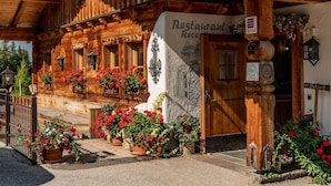 A wooden building with a sign reading "Restaurant" and "Reception".
