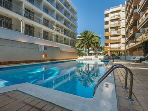 Relax by the pool surrounded by a spacious deck and stunning views of the surrounding buildings.