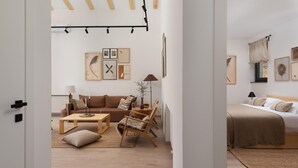 A modern, minimalist living room with a sofa, coffee table, and chairs. There is a bed with a headboard and a window with curtains. - Amazing home in Rizvanusa (Gospic)