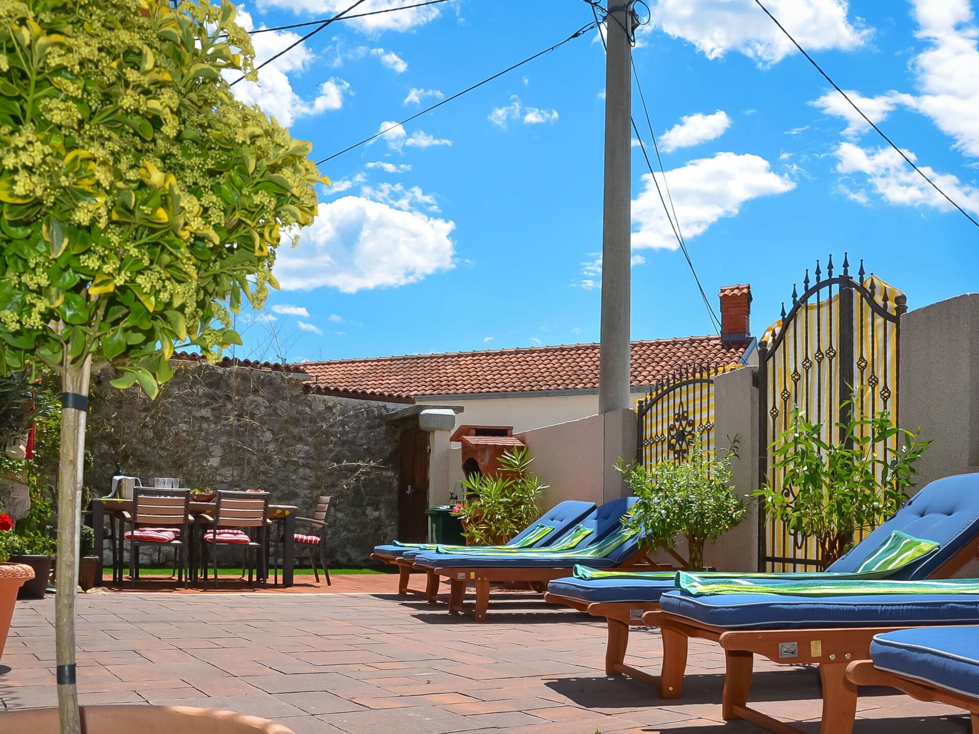 Cloud, Plant, Sky, Property, Building, Furniture, Blue, Table, Shade, Outdoor Furniture