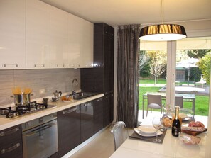 Oven, dishwasher, toaster, dining tables