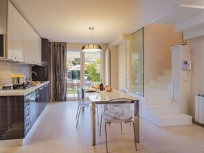 Oven, dishwasher, toaster, dining tables