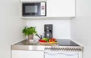 Fridge, stovetop, coffee/tea maker, cookware/dishes/utensils