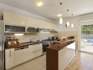 Cabinetry, Countertop, Kitchen, Building, Kitchen Appliance, Kitchen Stove, Wood, Interior Design, Flooring, Floor