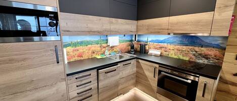 Microwave, oven, dishwasher, dining tables