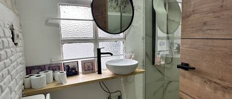 Shower, hydromassage showerhead, hair dryer, towels