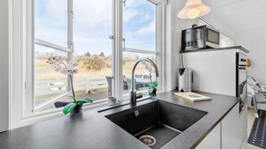 Coffee/tea maker, fridge, microwave, oven