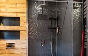 Enjoy a refreshing shower experience with a showerhead and handheld attachment.