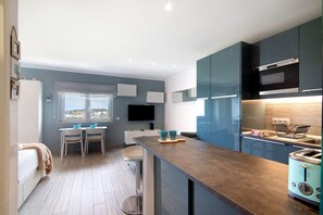 Fridge, microwave, stovetop, coffee/tea maker