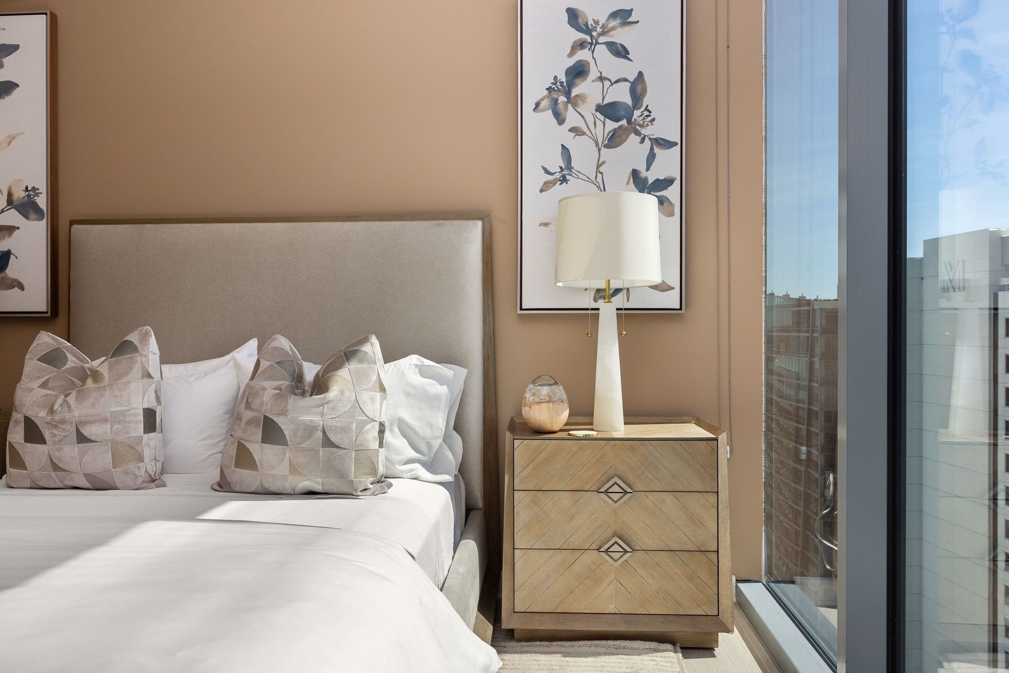 Secondary suite with a queen bed and a 55" 4K UHD TV