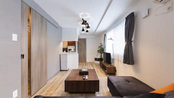 Basic Apartment | Living area | Flat-screen TV