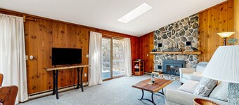 Pond & mountain view cabin with fireplace, workstation, W/D, deck, & internet