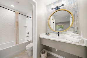 Shower, hair dryer, towels, shampoo