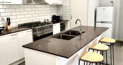 Clean and airy house in a family friendly neighbourhood. Home office available.
