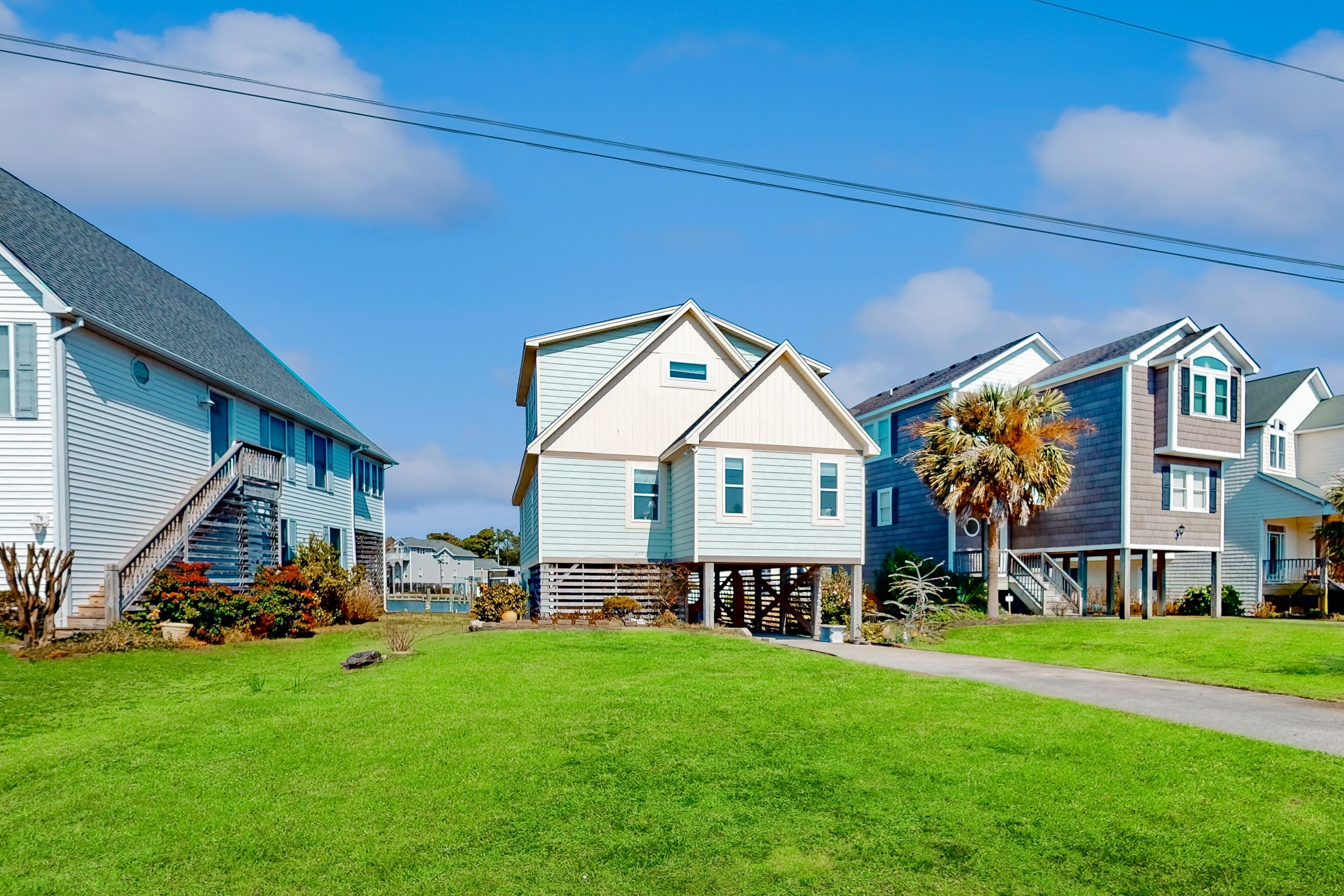 Waterfront home with deck, balcony, outdoor shower, water views, AC