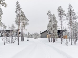 A snow-covered landscape with a building and trees. - Villa paadari by Interhome (Inari)