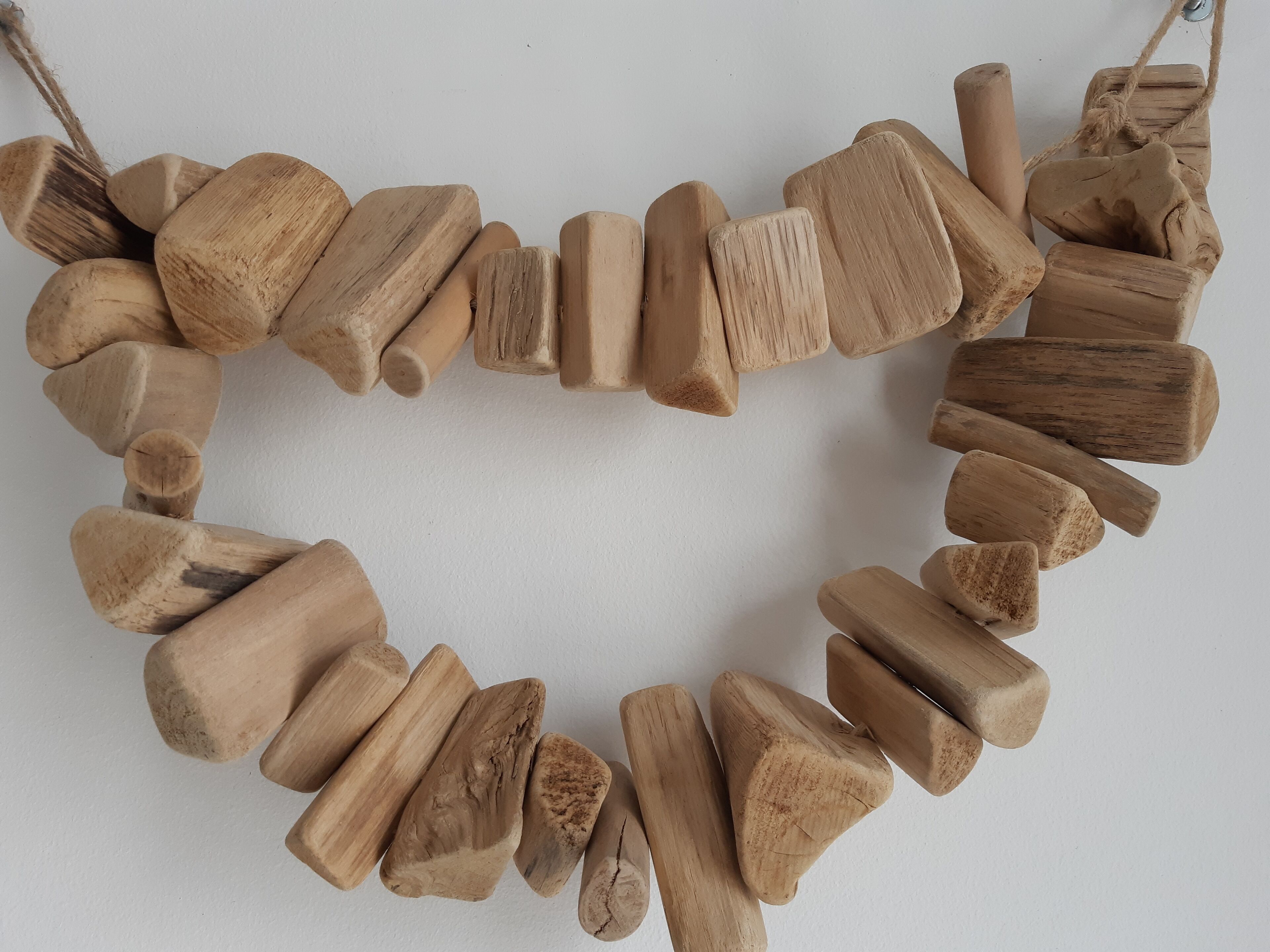 A necklace made of various wooden pieces.