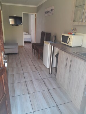 Luxury Double Room | Living area | Flat-screen TV