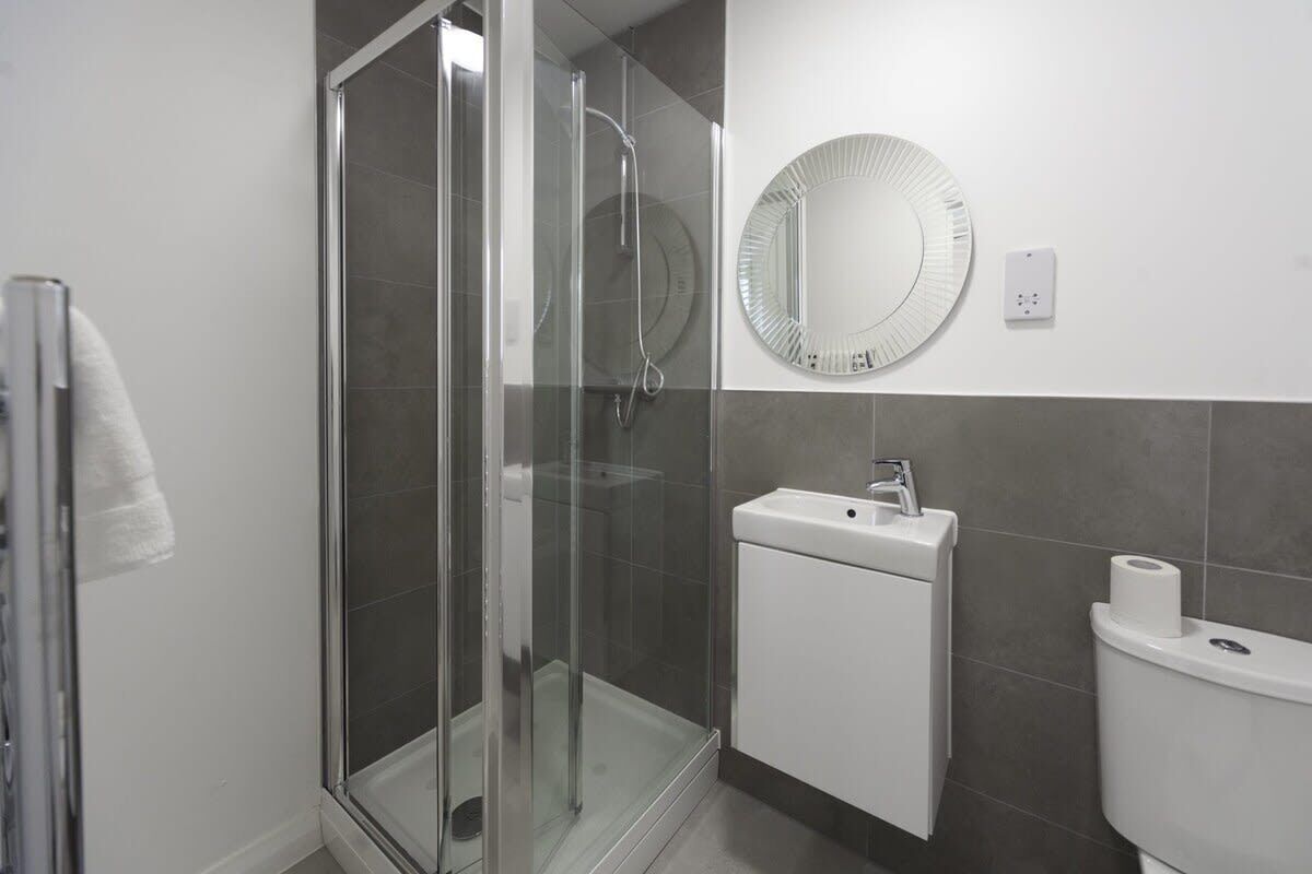 Shower, hair dryer, towels, shampoo