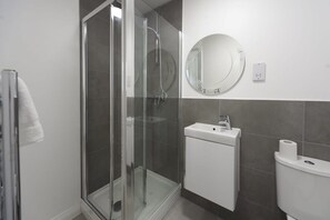 Shower, hair dryer, towels, shampoo