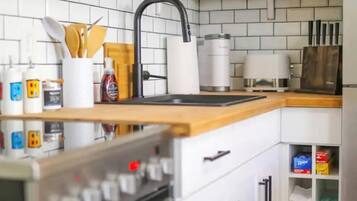 Fridge, microwave, stovetop, coffee/tea maker