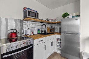 Fridge, microwave, stovetop, coffee/tea maker