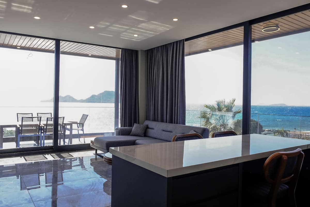 Exclusive Condo, Sea View | Living area | 105-inch Smart TV with premium TV channels, heated floors