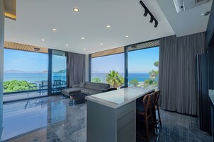 Panoramic Suite, 2 Bedrooms, Sea View, Beachfront | Living area | 105-inch Smart TV with satellite channels, Netflix, streaming services