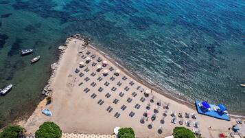 Private beach, sun loungers, beach umbrellas, beach volleyball