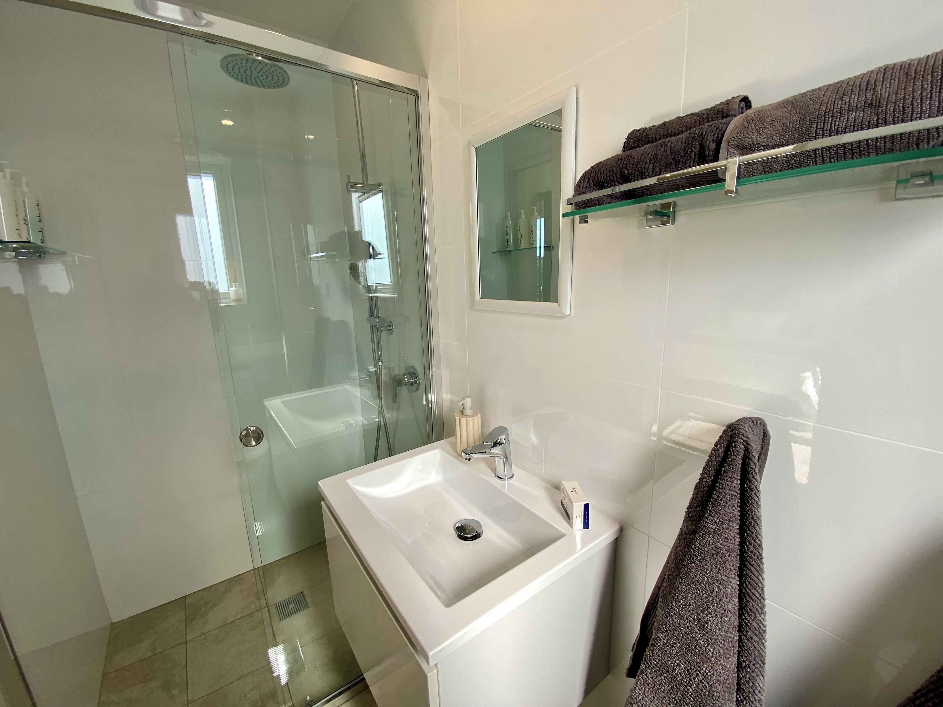 Shower, towels, soap, shampoo