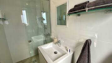 Shower, towels, soap, shampoo