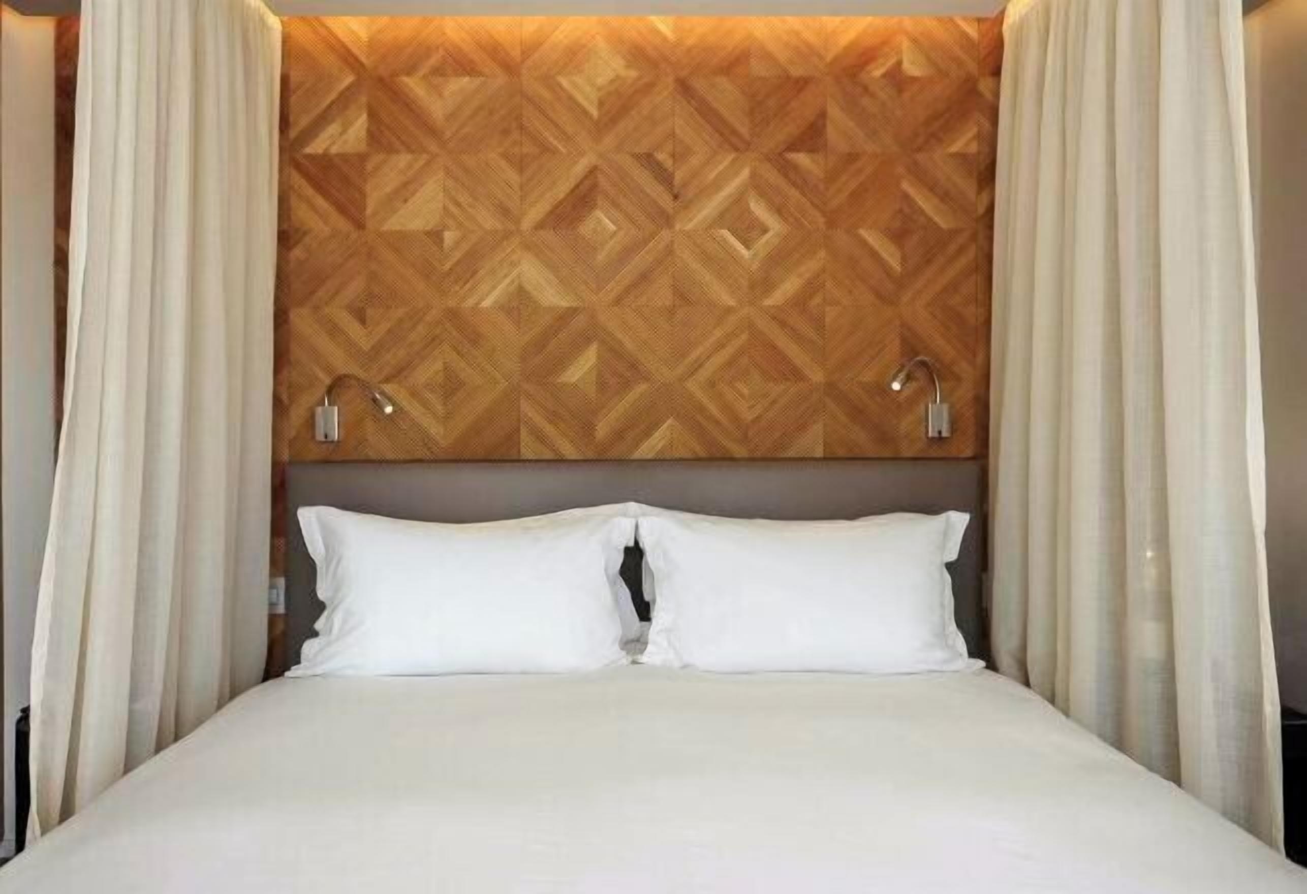 Premium bedding, down comforters, in-room safe, soundproofing