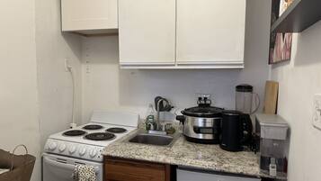 Fridge, microwave, cookware/dishes/utensils
