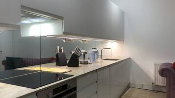 Oven, stovetop, dishwasher, dining tables