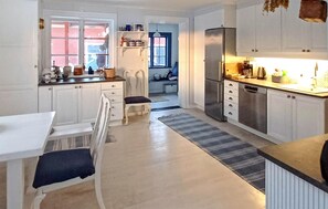 Fridge, stovetop, dishwasher, coffee/tea maker