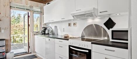 Fridge, stovetop, dishwasher, coffee/tea maker