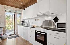 Fridge, stovetop, dishwasher, coffee/tea maker