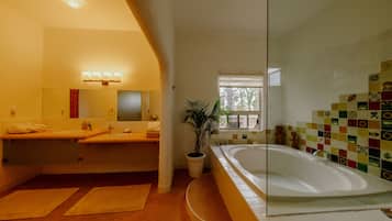 Deluxe King Suite | Bathroom | Shower, rainfall showerhead, hair dryer, bathrobes