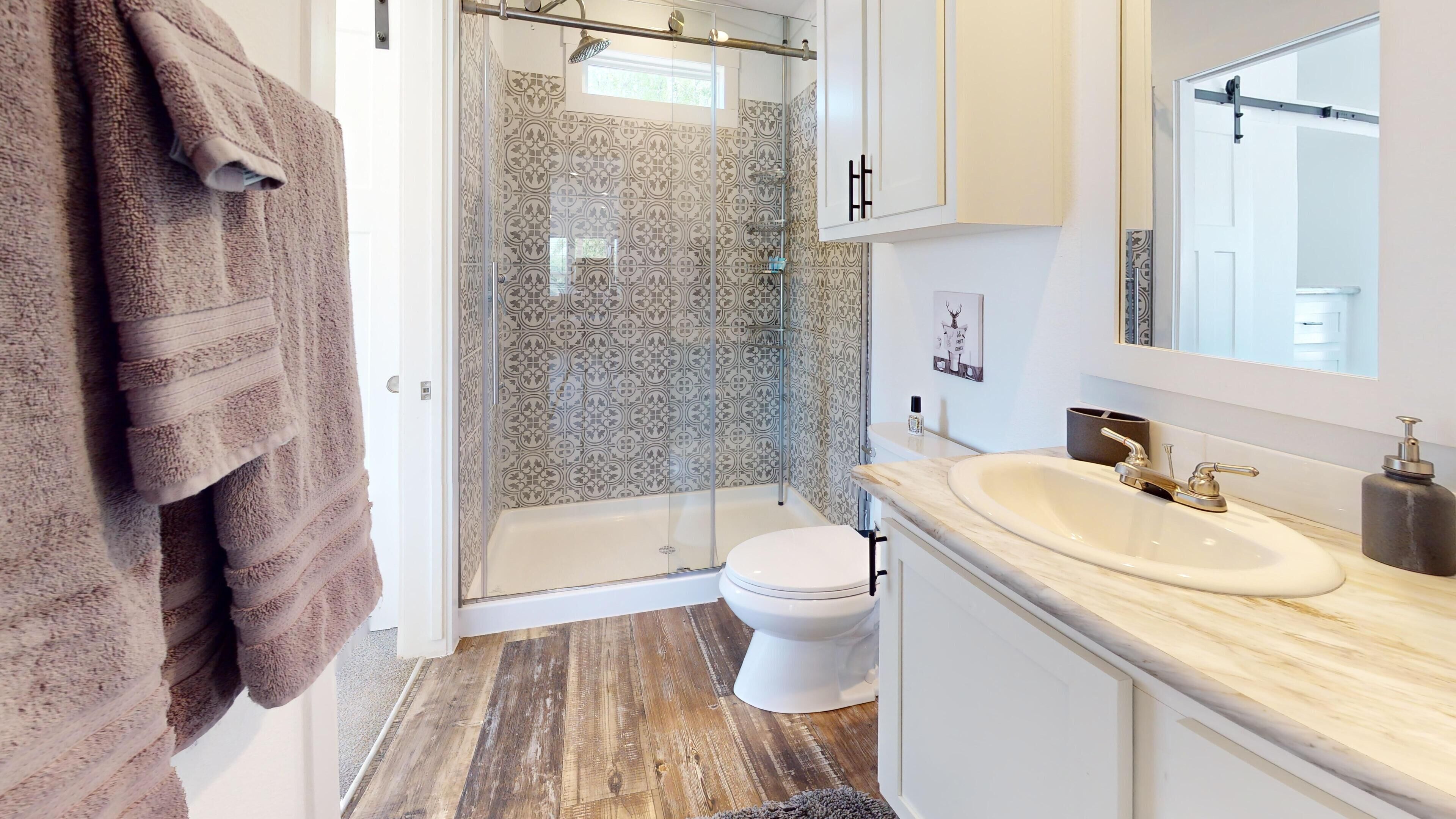 Shower, hair dryer, towels, soap