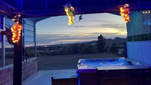 A hot tub area with a view of the landscape, including mountains and a body of water. - A retreat near Elephant Butte Lake with awesome views. Don’t miss out. Enjoy! (Elephant Butte)