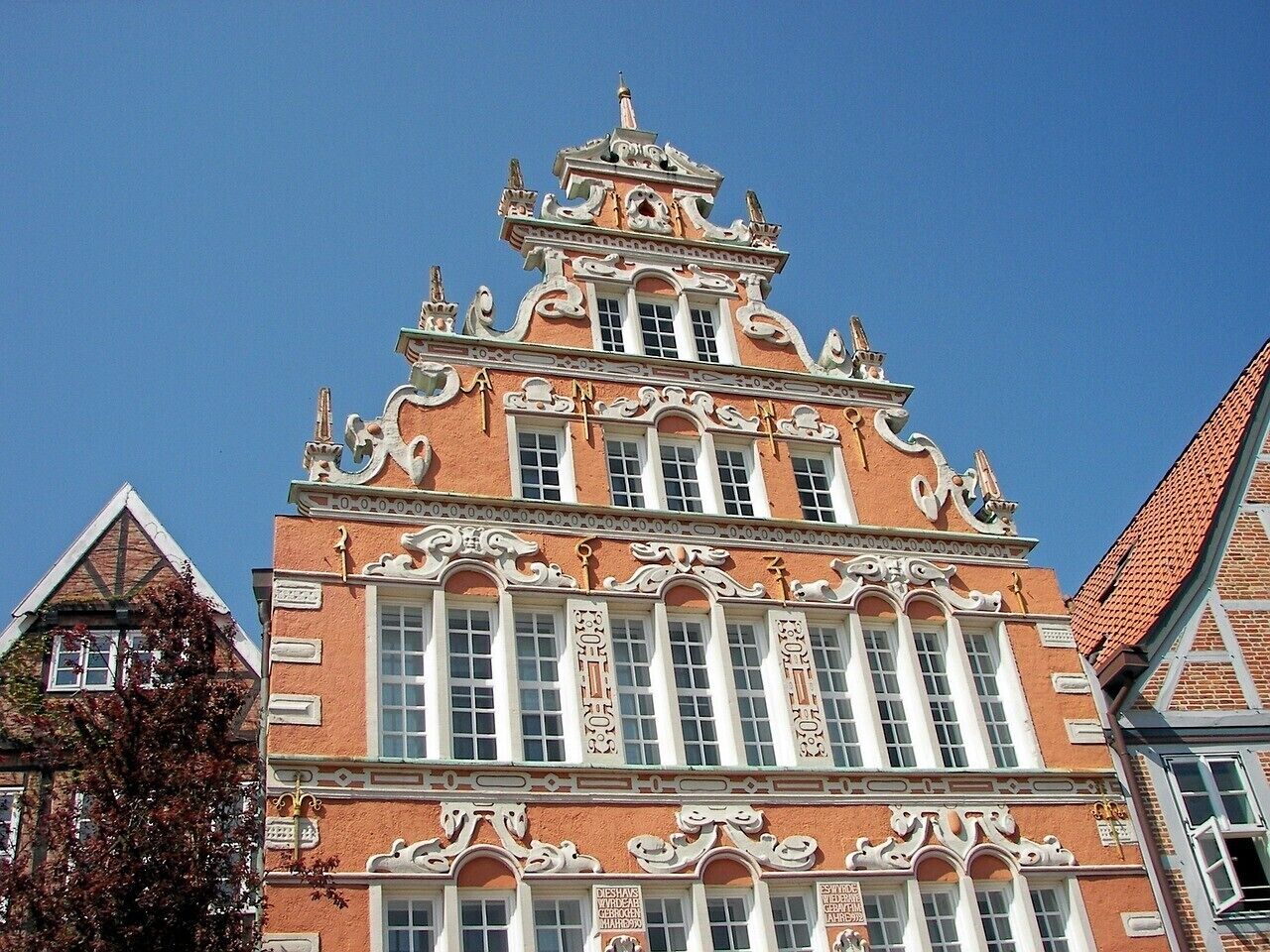 A historic building with ornate architectural details, large windows, and a prominent entrance.