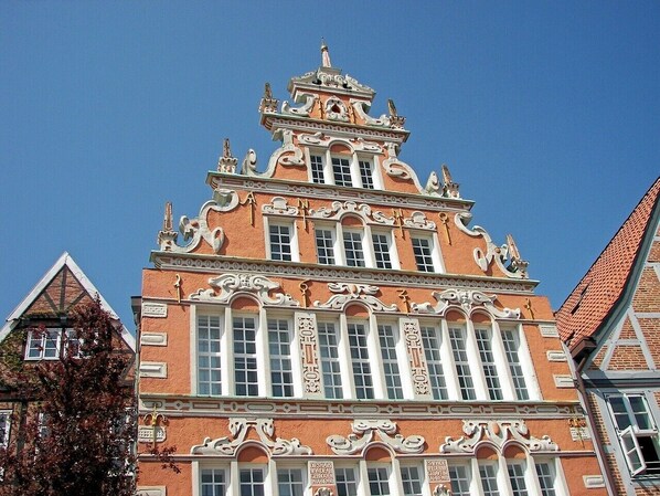 A historic building with ornate architectural details, large windows, and a prominent entrance.